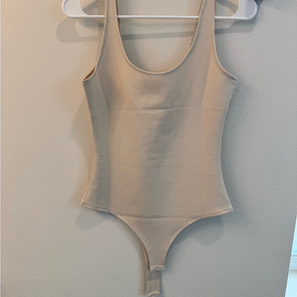 Stylish Beige Sleeveless Bodysuit